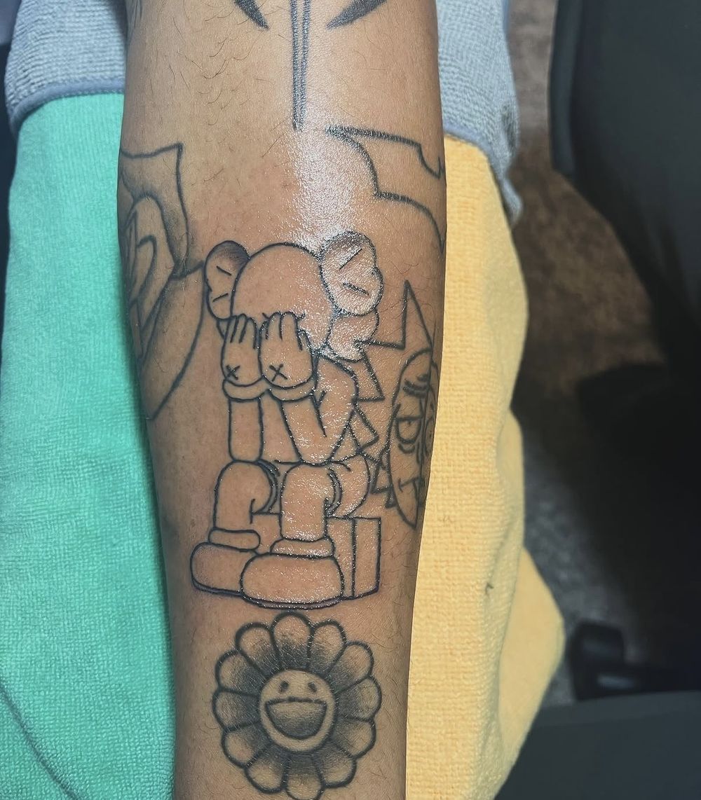 Companion character illustrative outline forearm tattoo
